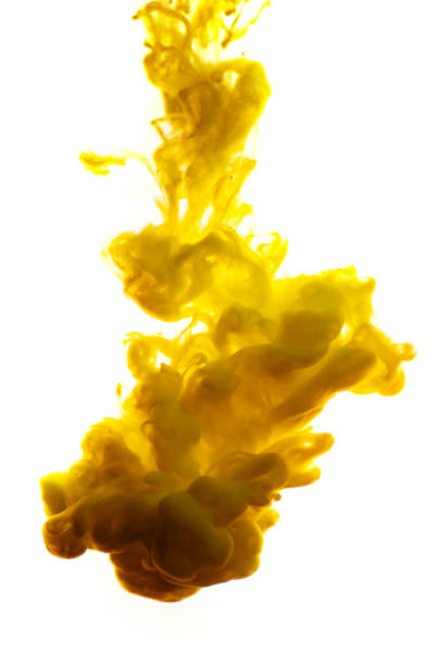 istock yellow ink in water isolated on white background 854363446