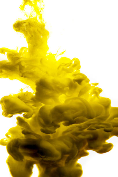 istock yellow ink in water isolated on white background 854366310