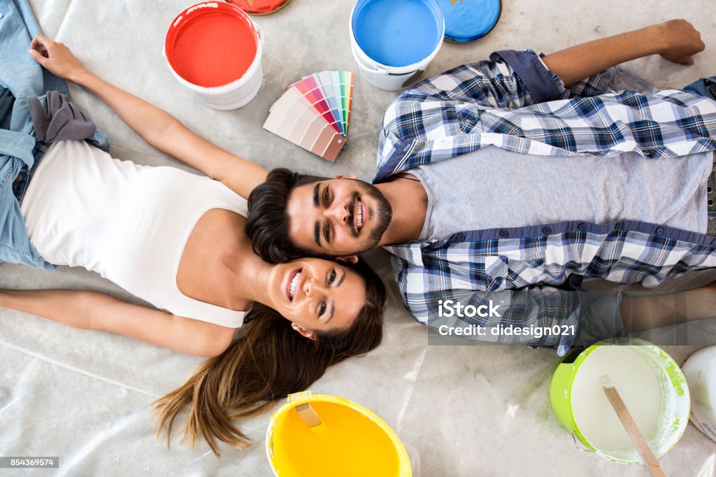 Young couple ready for renovation Young couple ready for renovation, choose witch color is yours Adult Stock Photo