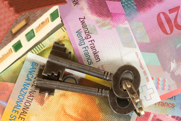 A house, house keys and Swiss francs