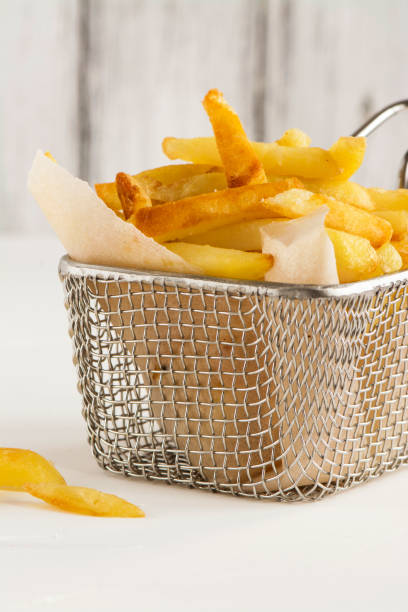 istock French fries in metal wire basket 854370704