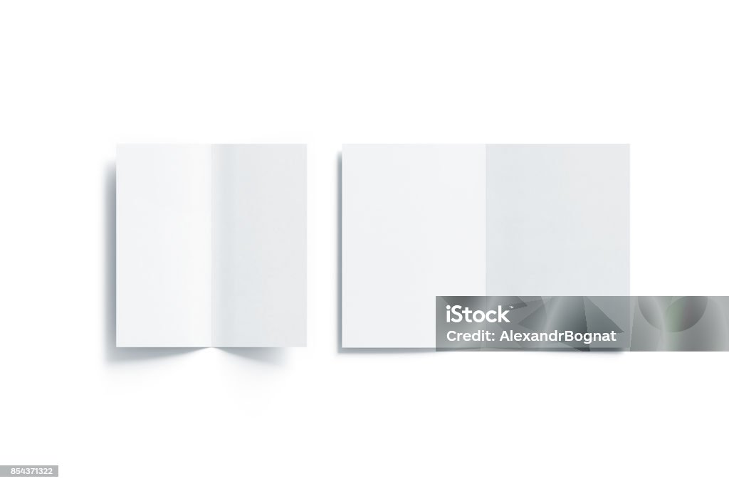 Blank white two folded a5 and dl booklet mock up Blank white two folded a5 and dl booklet mock up, opened side, top view, 3d rendering. Plain twofold brochures mockups set isolated. Book cover and flier inside, copy space. Template Stock Photo