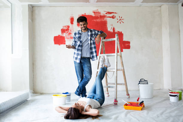 istock Young couple renovating their house 854371380