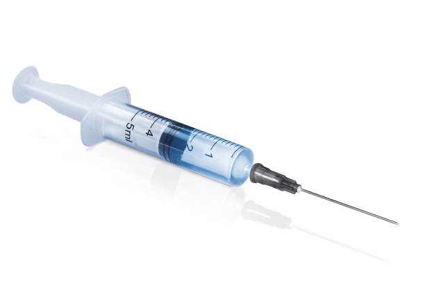Syringe closeup isolated on white background stock photo