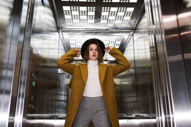 istock fashionable woman in elevator 854374066