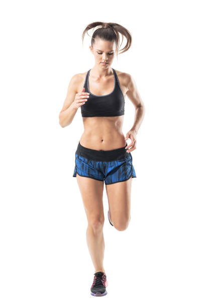 istock Front view of female athlete sprinter motion looking down with hair movement 854374214