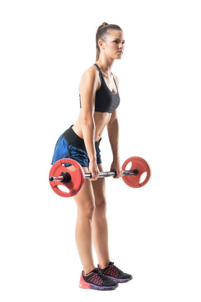 istock Full extended up position of female athlete doing deadlift exercise with barbell profile 854374886