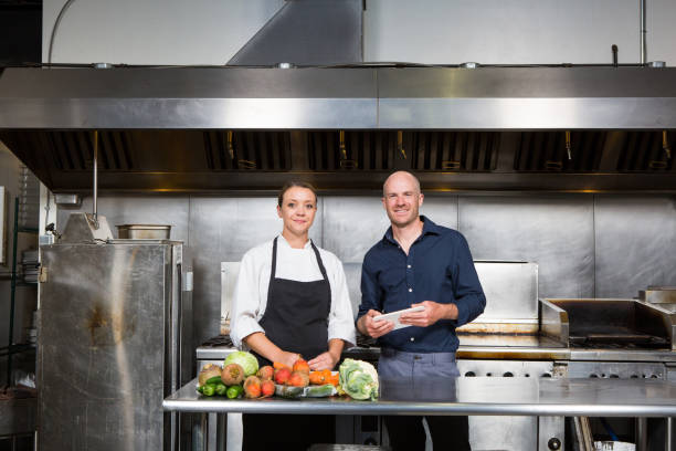 istock Restaurant manager works with a professional female chef 854374984