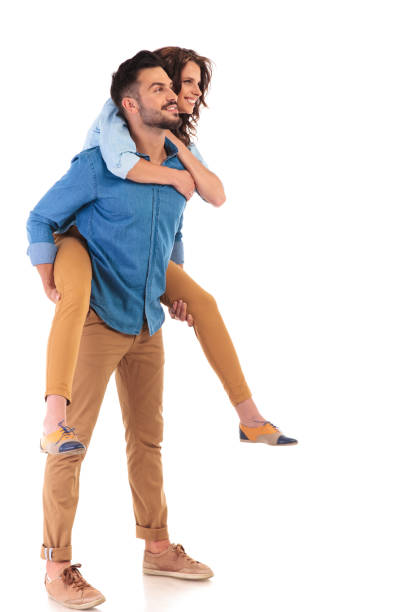 istock side view  of  smiling man carrying his girlfriend on back 854378478
