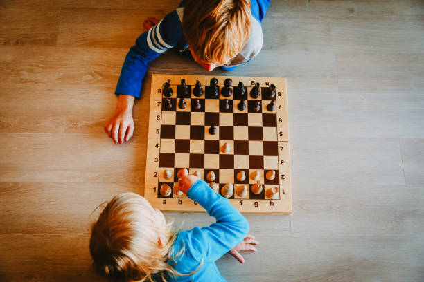 little boy and girl play chess, kids learn and play activities