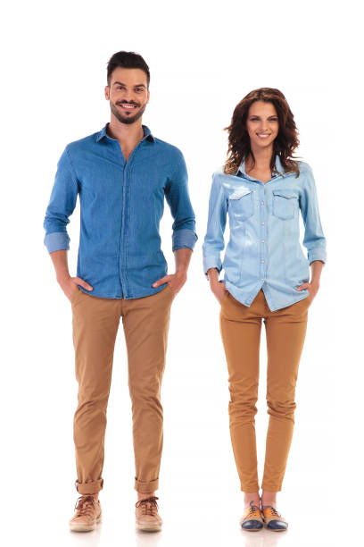 istock relaxed couple standing with hands in pockets 854379298