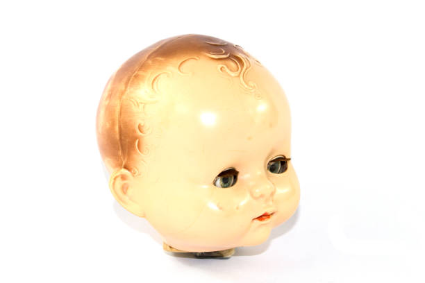 istock Toy Doll Dolly Baby Broken on a Plain Background 854385386