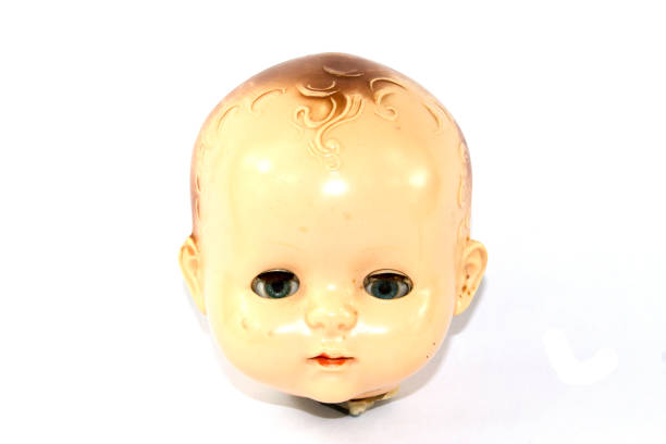istock Toy Doll Dolly Baby Broken on a Plain Background 854385424