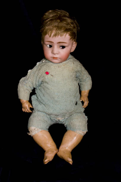 istock Toy Doll Dolly Baby Broken on a Plain Background 854388952