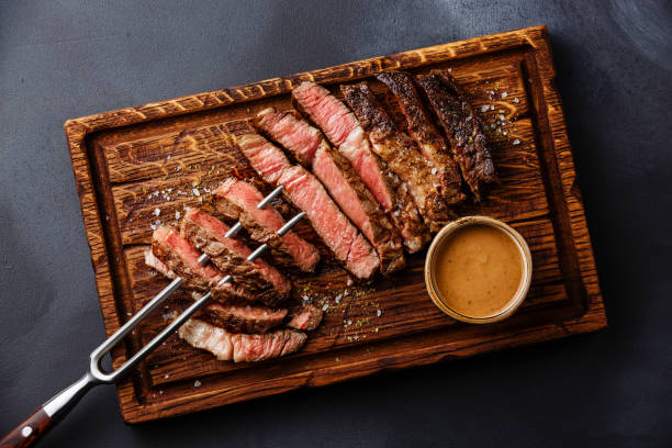 istock Sliced grilled meat steak Rib eye on meat fork 854389834