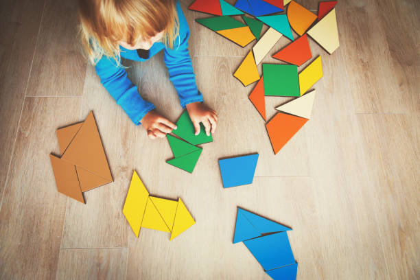 istock little girl playing with puzzle 854393320
