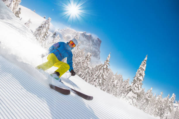 istock Skier skiing downhill in high mountains 854393828