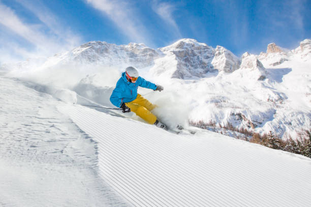 istock Skier skiing downhill in high mountains 854394040