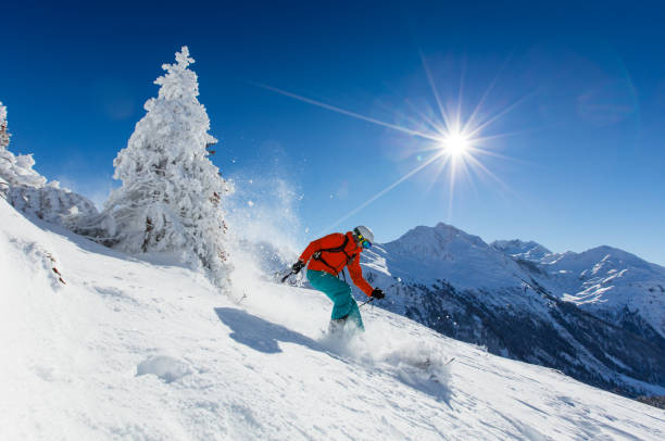 istock Skier skiing downhill in high mountains 854396274