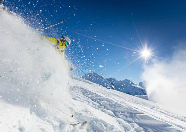 istock Skier skiing downhill in high mountains 854396484