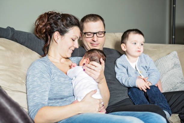 Young happy family with two children at home A Young happy family with two children at home 2000 photos stock pictures, royalty-free photos & images