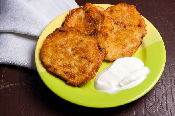 istock Potato pancakes with meat and sour cream 854397154