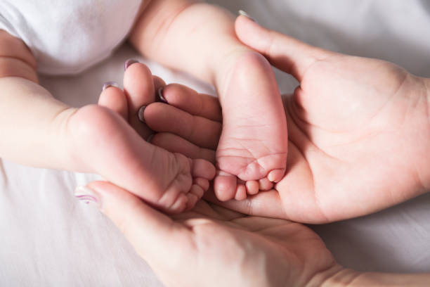 istock Little baby feet 854397172