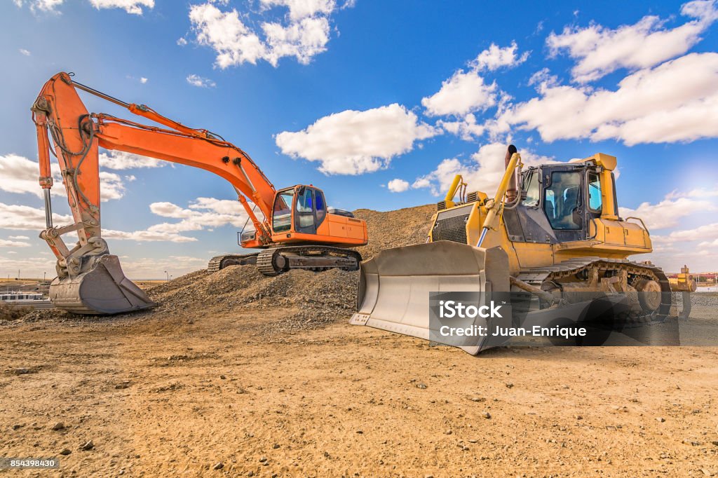 Heavy machinery in repair works of a motorway Heavy machinery in repair works of a motorway in Spain Construction Site Stock Photo