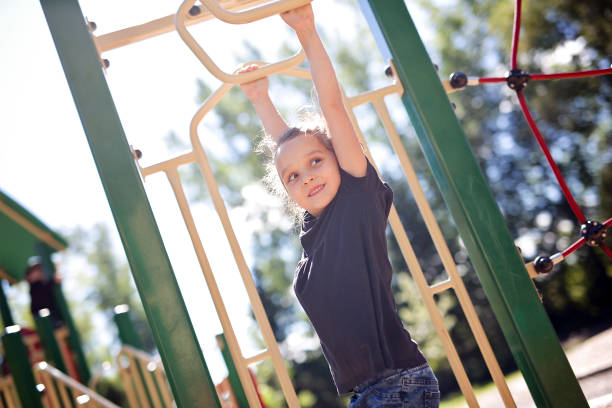 istock Active little girl on playground 854398902