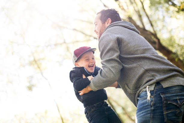 istock Father and son in forest on a meadow 854402884