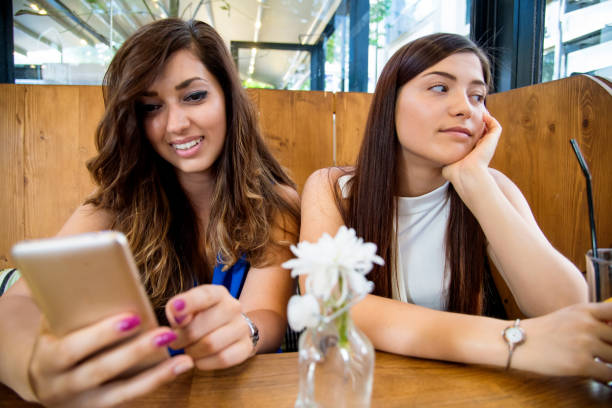 istock Girls in a cafe 854405350