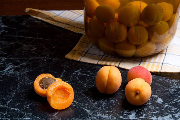 istock Juicy harvested apricots and canned apricot compote 854405638