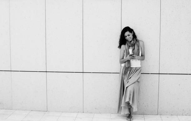 Beautiful woman is holding mobile phone