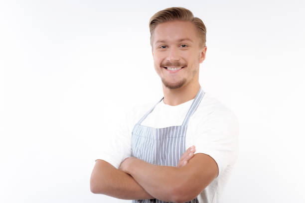 istock Fair-haired man posing with his arms folded across chest 854409590