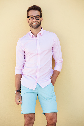 Smiling dude in pink shirt and shorts, portrait