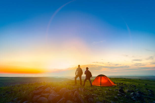istock Two young men enjoying camping in the wild 854411746