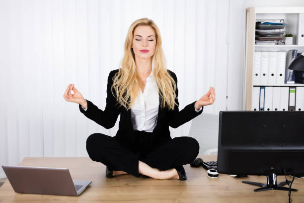 istock Woman Doing Yoga In Office 854414320