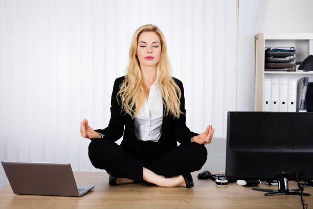 istock Woman Doing Yoga In Office 854414378