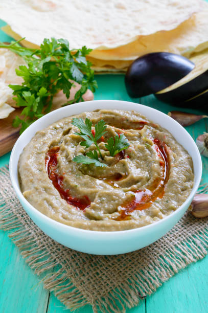 istock Baba ganush - hummus from eggplant with seasoning, parsley. Eastern cuisine. 854415032