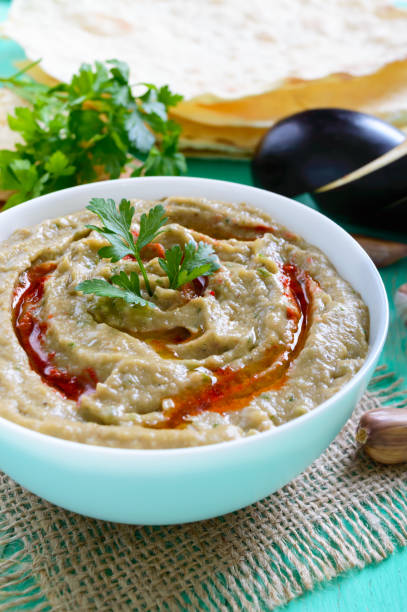istock Baba ganush - hummus from eggplant with seasoning, parsley. Eastern cuisine. 854415044