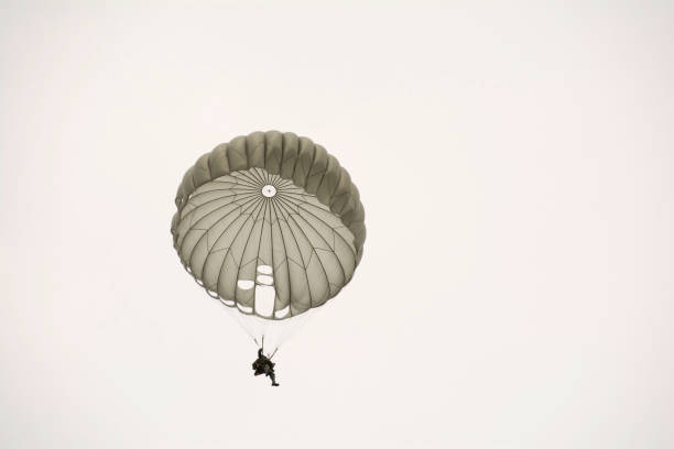 istock Parachute soldiers in the sky. 854415530