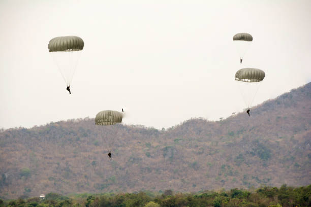istock Parachute soldiers in the sky. 854415566