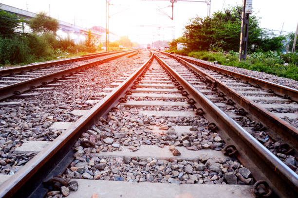 Railway track Railroad track at the time of sunset. railway signal stock pictures, royalty-free photos & images