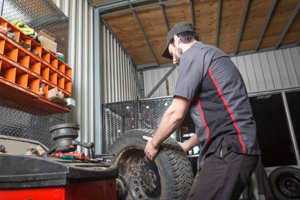 istock Mechanic working on car in his shop 854423004