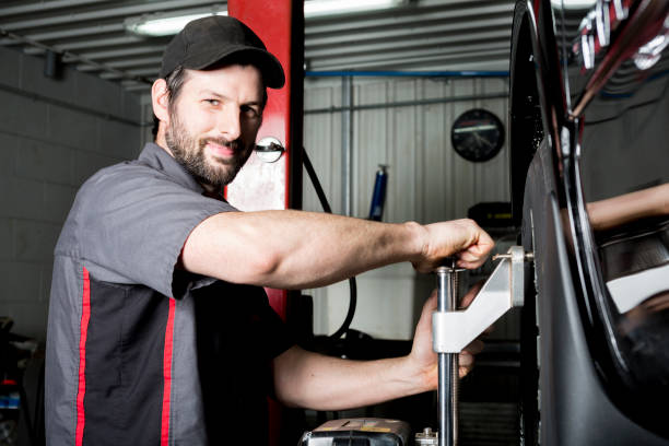 istock Mechanic working on car in his shop 854423548