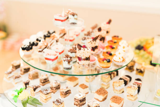 istock Delicious sweets on wedding candy buffet with desserts, cupcakes 854429638