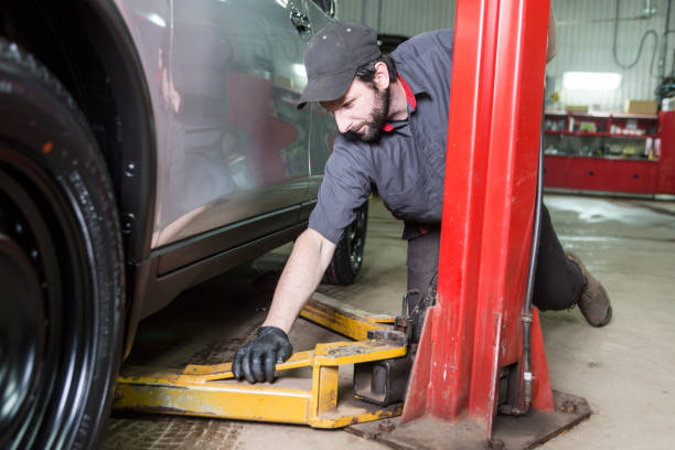 istock Mechanic working on car in his shop 854431316