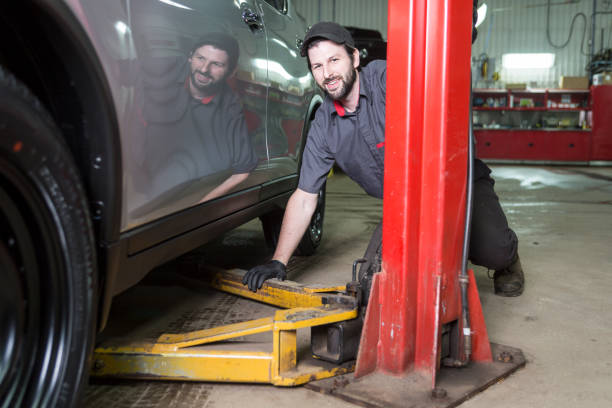 istock Mechanic working on car in his shop 854431378