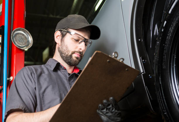 istock Mechanic working on car in his shop 854435994