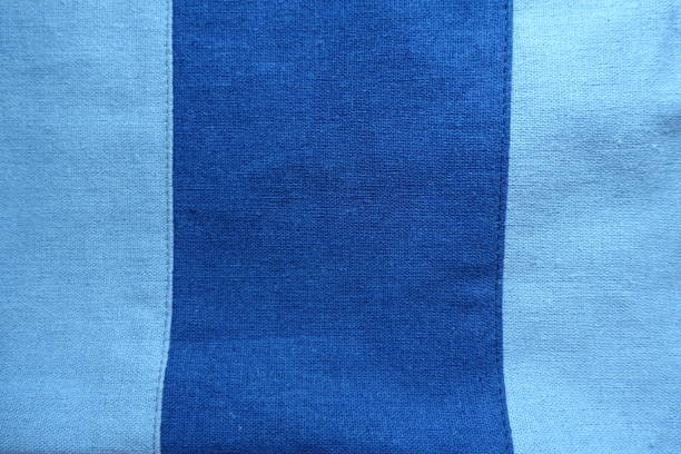 istock Wide dark stripe sewn to sky blue linen 854436070